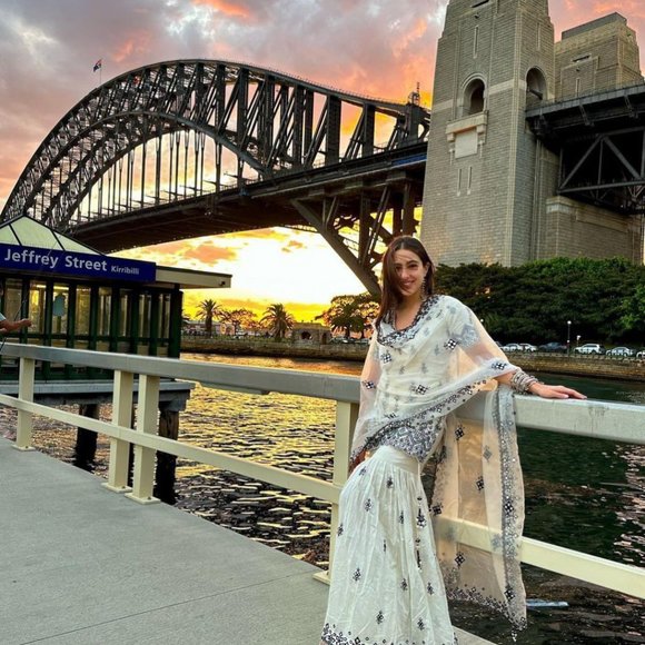 BEAUTIFUL SARA ALI KHAN WHITE SHRARA SET WITH ALL OVER SEQUENCE EMBROIDFERY WORK - Picture 3 of 12